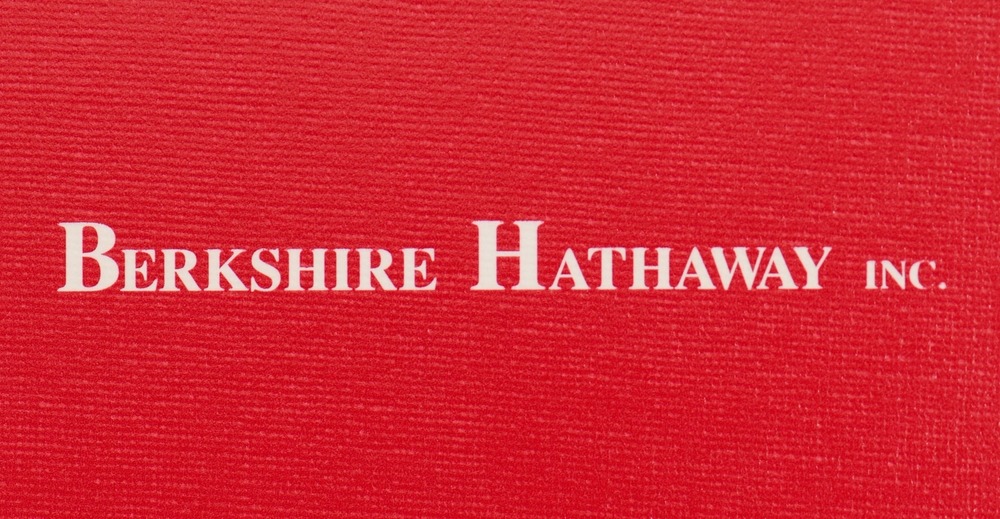 close up,of,berkshire,hathaway,logo,with,ceo,warren,buffett,operating