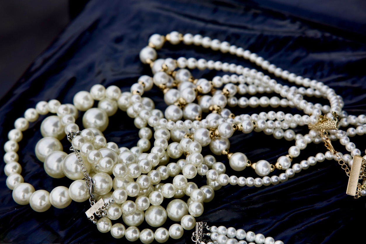 strands of antique pearls on black velvet